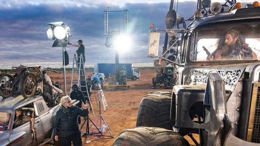 George Miller on the set of one of his Mad Max Movies.